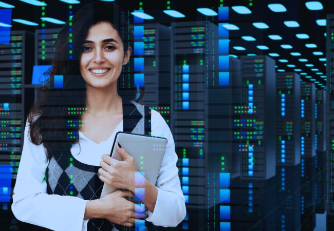 Happy person decommissioning a data center, standing in a server room