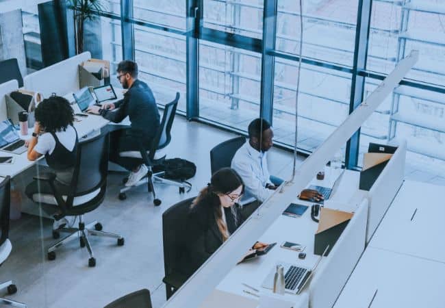 an overhead view of people working in an office