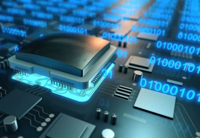 close up of a glowing computer microchip on a circuit board